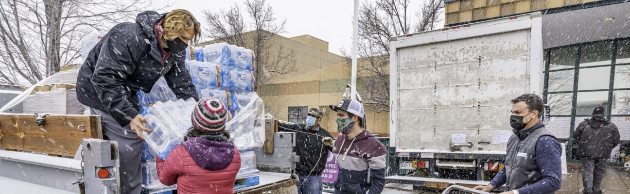 Humanitarian aid workers handing out water