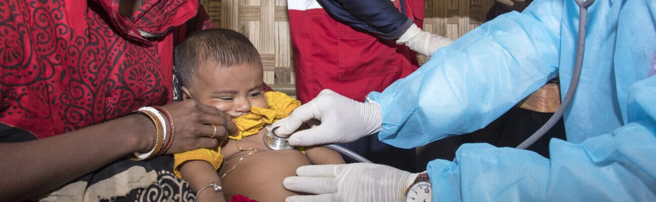 Medic does a check-up on a baby