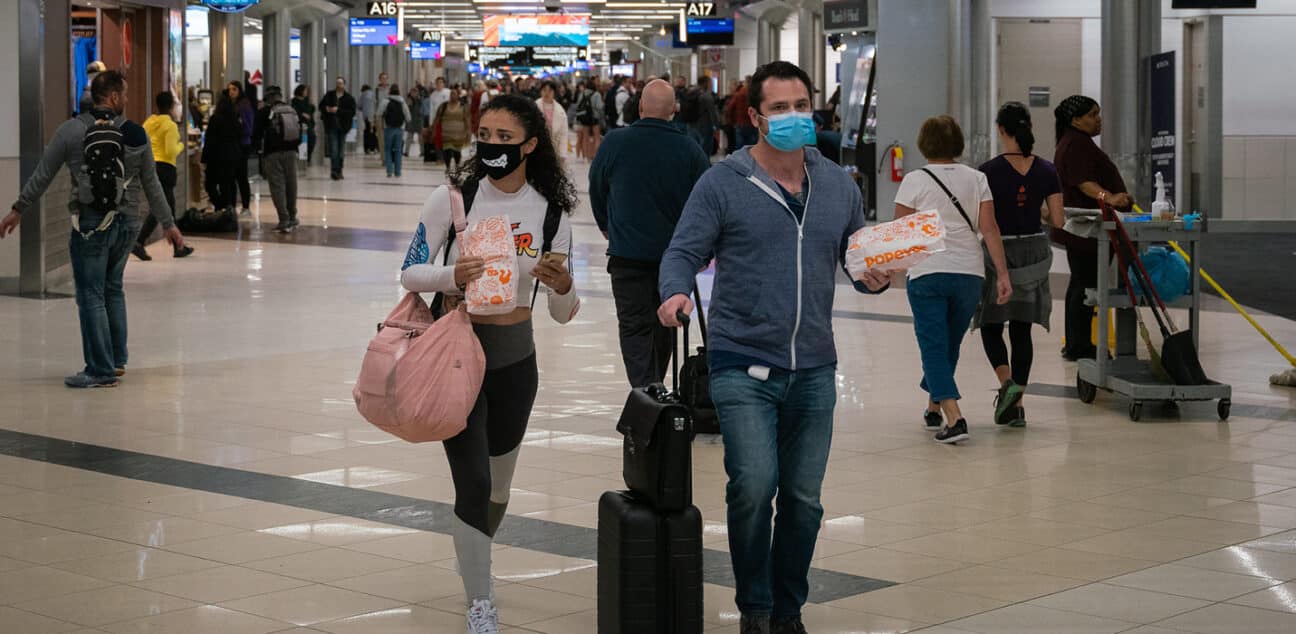 Flyers at Hartsfield-Jackson Atlanta International Airport wearing facemasks