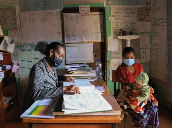 Elfinesh Tefera, a health extension worker supporting Birtukan Fetene, a mother of four with her two months old son, Amanuel Wondemu