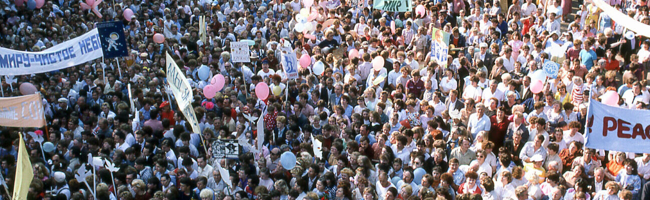 A crowd of people protesting for peace