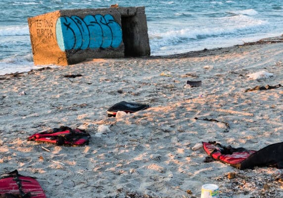 Abandoned lifejackets on a beach