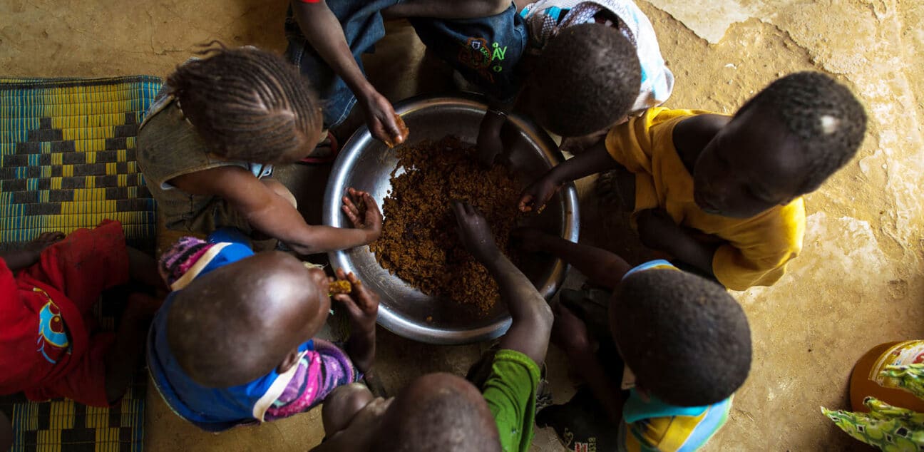 Senegalese children eating from a bowl together