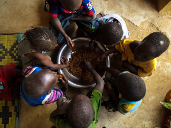 Senegalese children eating from a bowl together