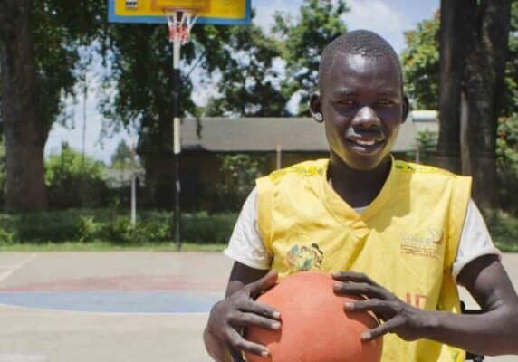 Denis preparing to play wheelchair basket ball in Uganda