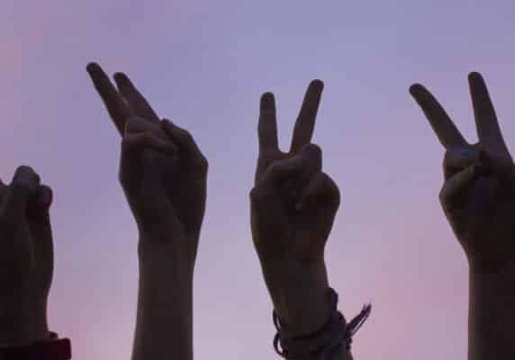 Hands making a peace sign