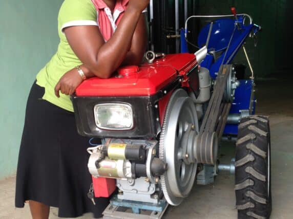 A woman in Nigeria with a Hello Tractor smart tractor