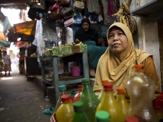 Woman in street in Prumpung, Jakarta, Indonesia