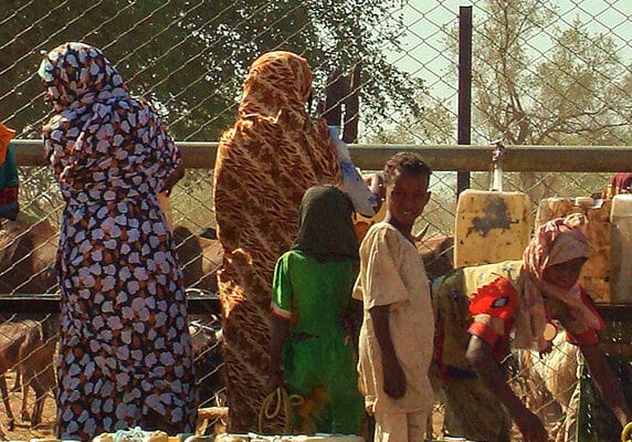 Sudanese women waiting in line to fetch water in Al Fashir, capital of North Darfur, Sudan.