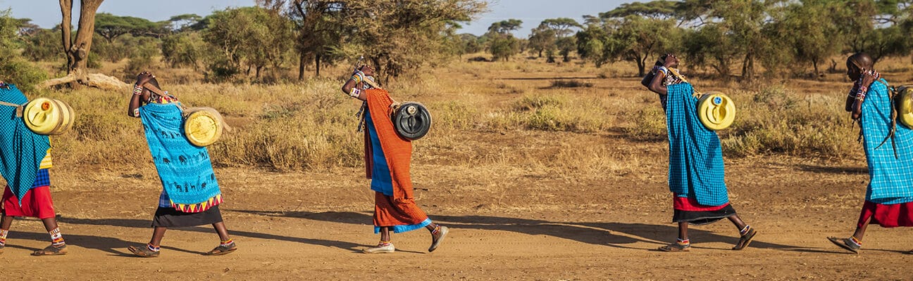 women from Maasai tribe carrying water, Kenya, East Africa