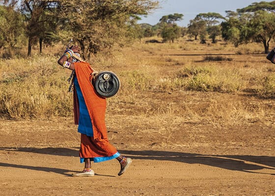 women from Maasai tribe carrying water, Kenya, East Africa