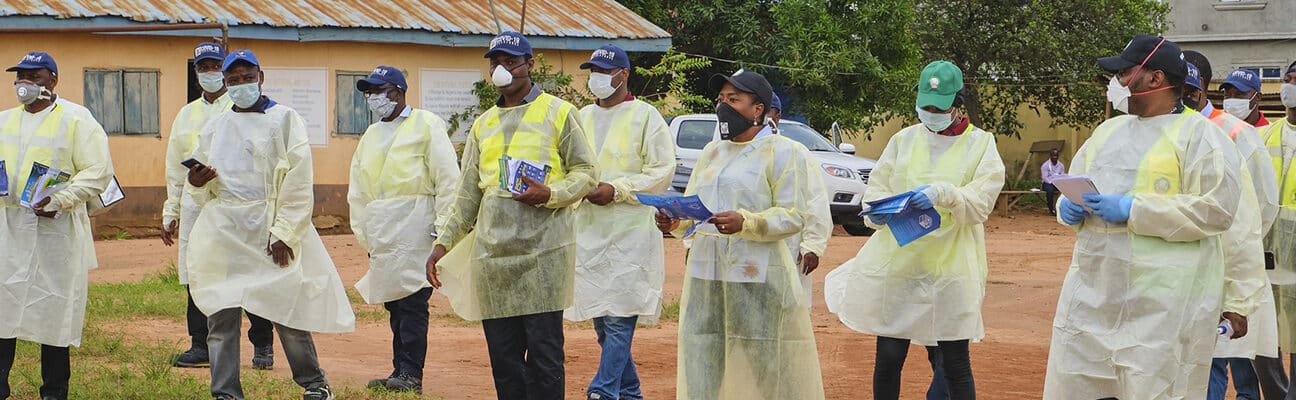 People dressed in Covid-19 PPE