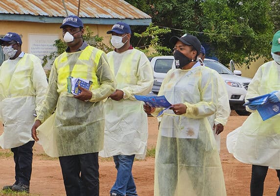People dressed in Covid-19 PPE