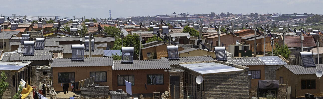 Alexander Township in Johannesburg, South Africa, showing new low cost homes fitted with Solar Power for hot water geysers.