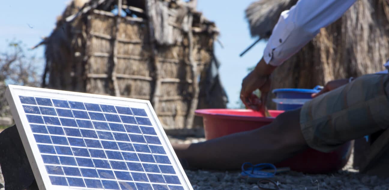 Solar panel next to a man eating