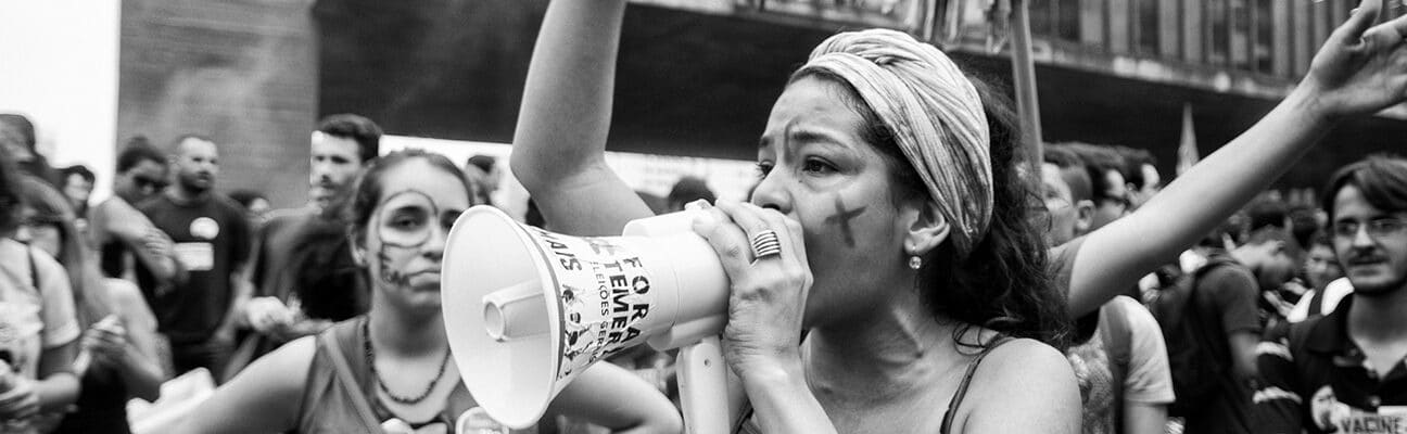 Woman with a megaphone shouting slogans during act against the coup and calling for new elections and other social agendas for the country
