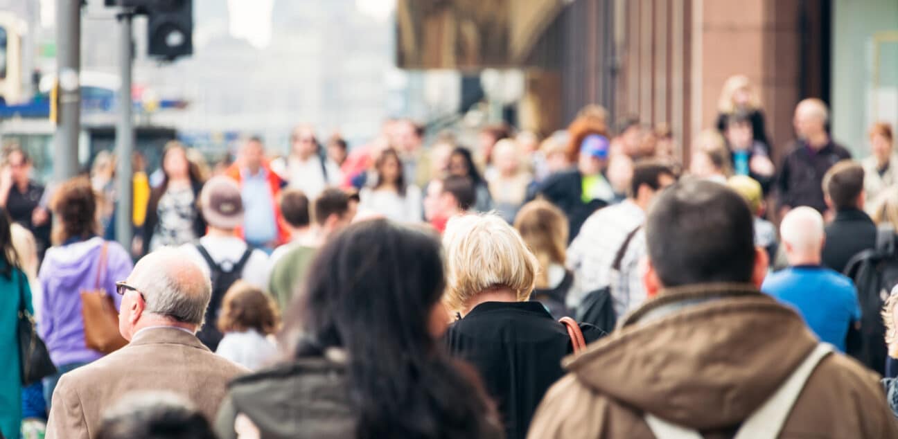 People walk in a busy street