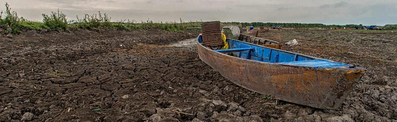 A boat in a dried river bed