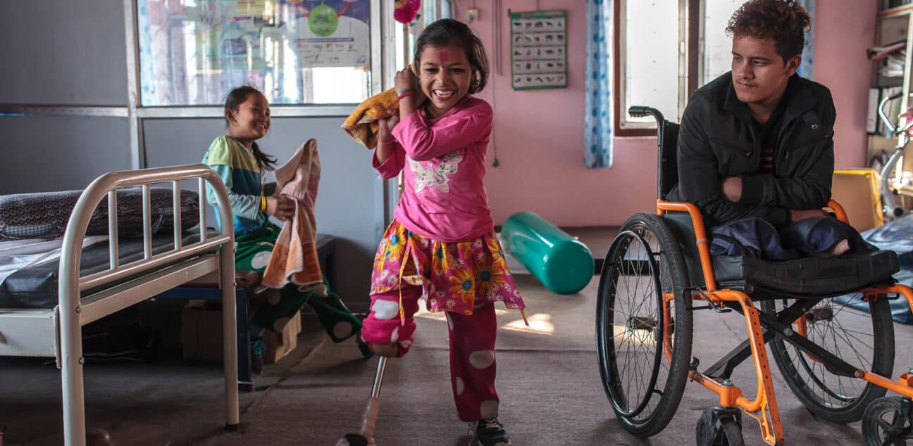 Nirmala practices walking with her new leg at the National Disabled Fund in Nepal