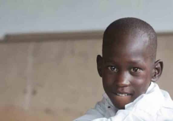 Young boy sits in a wheelchair