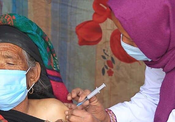 An 81 year old women receiving a vaccine in Nepal. UNICEF