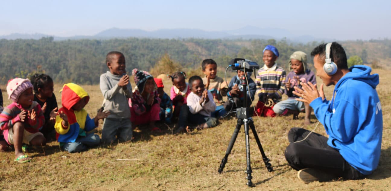 Man playing clapping games with children