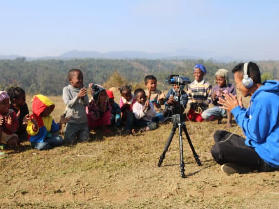 Man playing clapping games with children