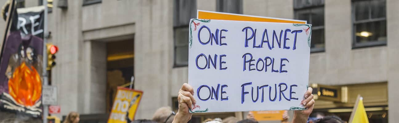 Woman carrying placard