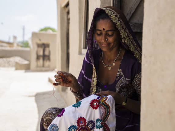 Woman stitching some clothing