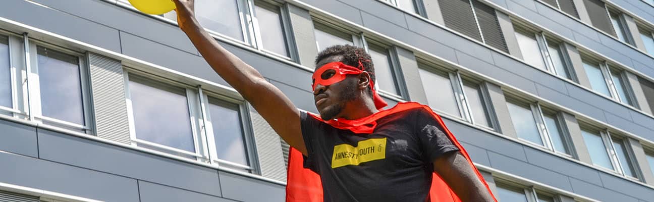 Youth activist dressed as a superhero in Berne, Switzerland