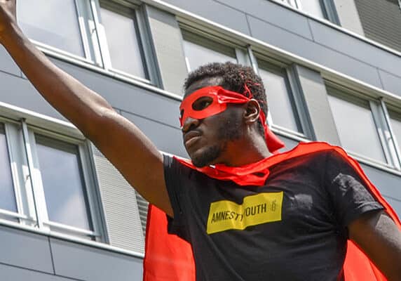 Youth activist dressed as a superhero in Berne, Switzerland