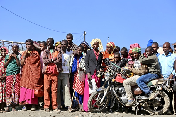 A large Maasai community gather for the Ace Africa drama performance, Kisongo, Arusha