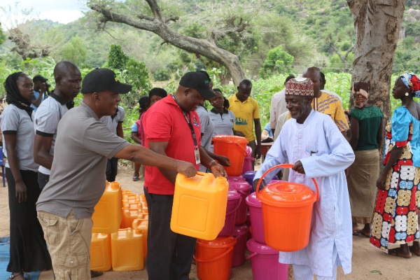 Distributing jerrycans to promote hygiene in Adamawa State Nigeria
