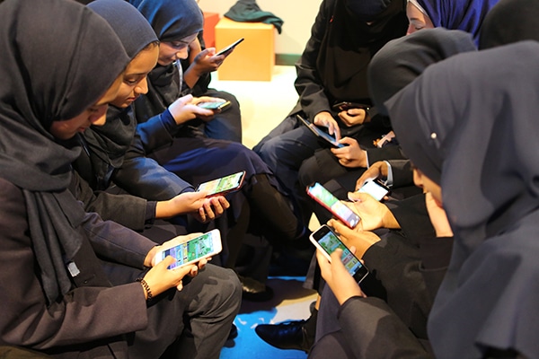 Girls from Manchester Islamic girls school play virtue reality at the national video game museum in Sheffield 