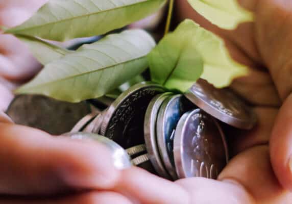 A Tree and Coins in a Hand