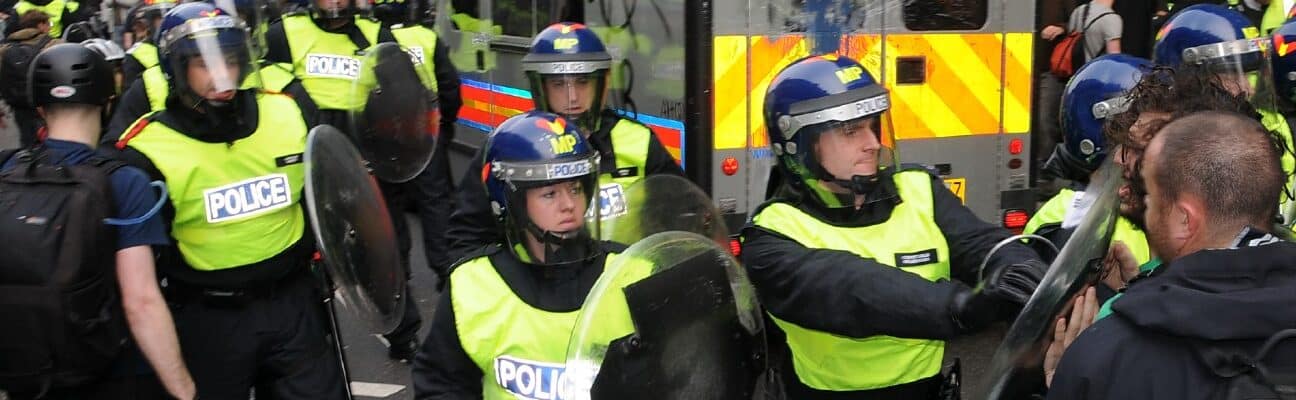 PROTESTERS AND RIOT POLICE CLASH DURING A TUC ORGANISED AUSTERITY RALLY. THE RALLY DREW AN ESTIMATED 250,000 PEOPLE TO THE BRITISH CAPITAL WITH A MINORITY OF PROTESTERS CLASHING WITH POLICE AND VANDALSING PROPERTY.