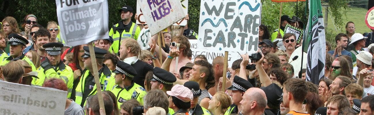 People gather to protest against the energy company Cuadrilla in Balcombe, UK. The company is currently test drilling for oil in the village and it is feared this could lead to potential fracking.
