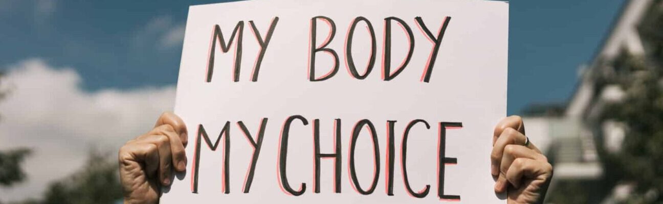 Woman holding a sign "My Body, My Choice"