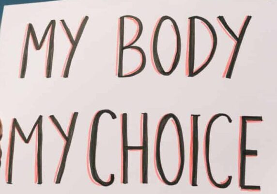 Woman holding a sign "My Body, My Choice"