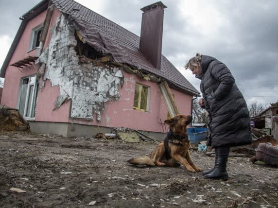 A woman stands near her shelling-damaged house in the village of Novoselivka, Chernihiv Oblast, Ukraine. Credit: Oleksandr Ratushniak / UNDP Ukraine