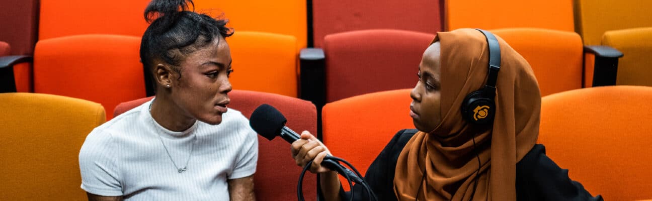 Tanzanian student Munira Kaoneka interviews burn victim survivor Thinasonke Kambi as part of a narrative non-fiction podcast training led by Radio Workshop in Cape Town.