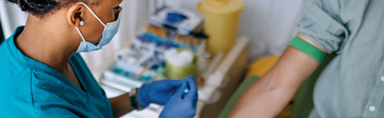 Doctor preparing patient to do a blood test.