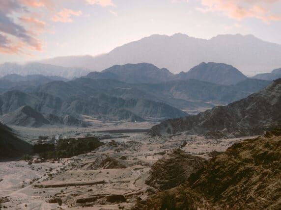 Sunrise over the Khyber Pass in Afghanistan with mountains in shadow.