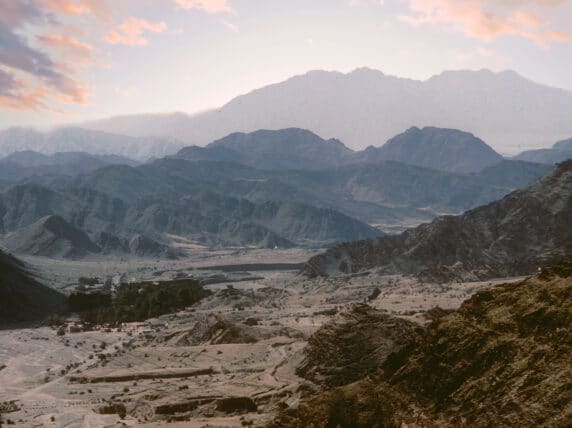 Sunrise over the Khyber Pass in Afghanistan with mountains in shadow.