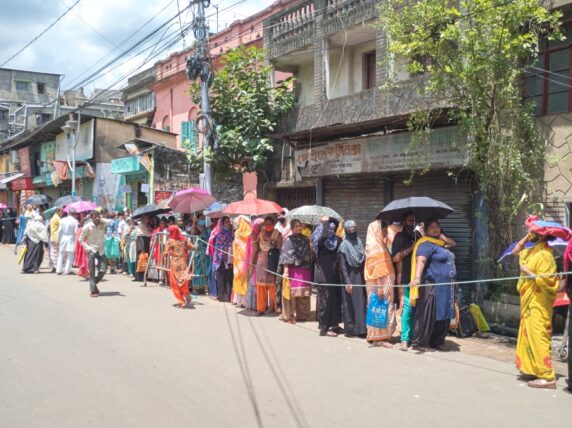 Women queue in Howrah Maidan, West Bengal.