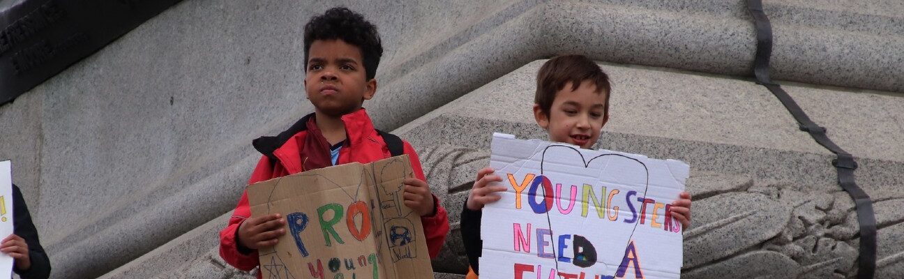 Two young people at the Youth Climate Strike, London. Credit: Roy Hutch