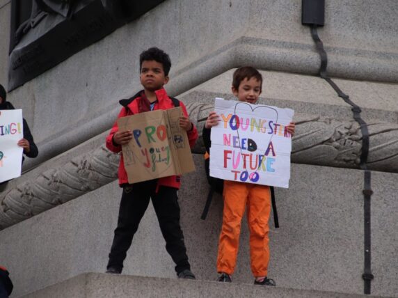 Two young people at the Youth Climate Strike, London. Credit: Roy Hutch