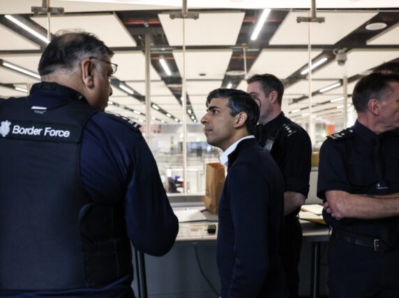 Rishi Sunak speaks with Border Force staff as he visits the south terminal at Gatwick Airport. Picture by Simon Dawson / No 10 Downing Street