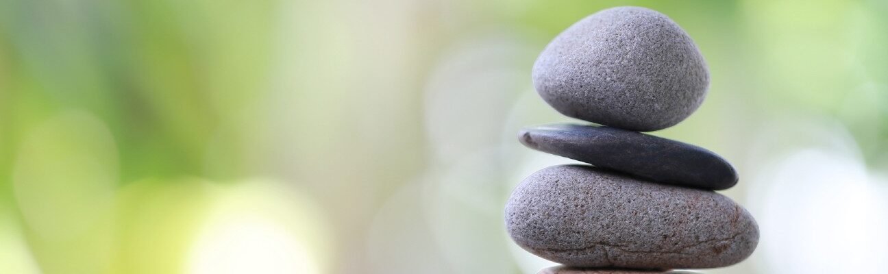 Balancing stones symbolising equitable partnerships