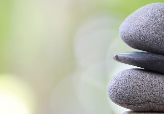 Balancing stones symbolising equitable partnerships